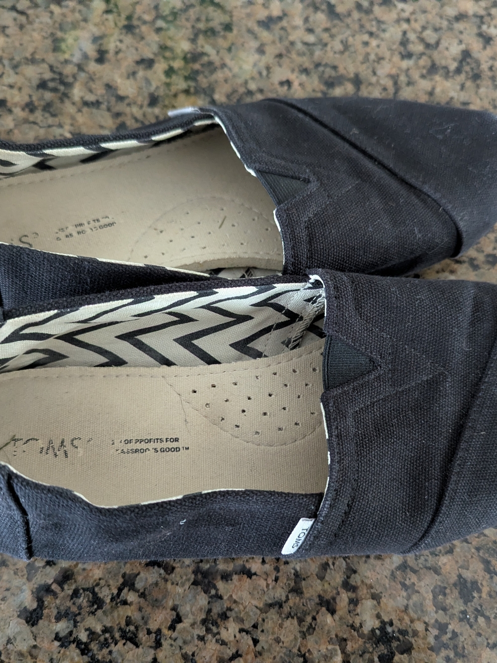 Toms Black Canvas Slip-Ons with Chevron Lining